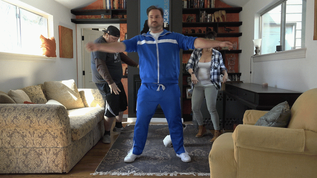 Jason, Deb and Nick dancing in Deb's living room.