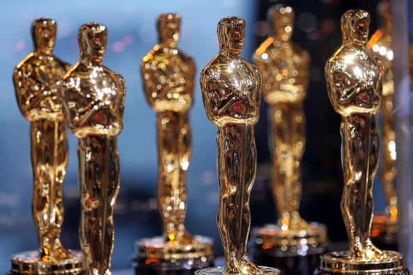 Oscar awards in a line.