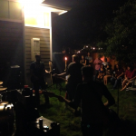 Img 2412 B: jason and his band performing for a small crowd in a friend's backyard