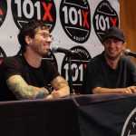 101X-Session With Twenty Øne Piløts: Twenty One Pilots Josh & Tyler smiling while sitting down for a press conference with 101X