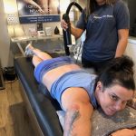 It's My Back!: Deb getting a cryotherapy treatment on her back with the masseuse. 