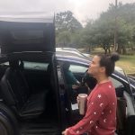 Deb Sees Jason' s Tesla For The First Time: Deb outside viewing Jason's new Tesla. 