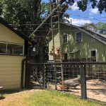 What's Going Down In Deb's Neighborhood?: A ladder in front of Deb's house with a fallen tree in front. 