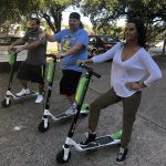 Get Set : Jason, Deb and Nick try out lime scooters in the Emmis Austin radio from parking lot. 