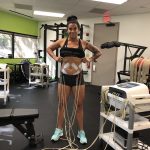 Deb Showing Off Her NeuFit 8 Pack  : deb with neufit pads on her abs 