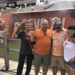 Beto Blvd. : Deb and friends on the field showing their horns before the game. 