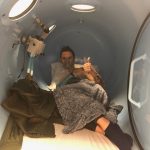 Deb Does Hyperbaric Oxygen Therapy At ATX Hyperbarics: Deb O'Keefe giving a thumbs up inside a hyperbaric chamber