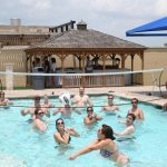 Memorial Day Drunk Fight: Jason and Deb playing volleyball with listeners in the Round Rock Express pool