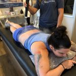 It's My Back!: Deb getting a cryotherapy treatment on her back with cold spray. 