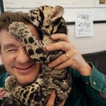 Joel With A Kitty Cat: © Photo by Joel Sartore/National Geographic Photo Ark