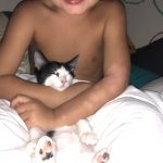 Memories Of George: A child holding Deb