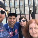 Jason Visits London: Jason, his mom and two friends taking a selfie in front of a fence in London. 