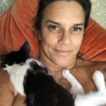 Memories Of George: Deb and her cat George laying in the bed. 