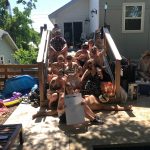 Jason Dick's Cinco De Derby Party: various members of the listener tree house posing on the steps in Jason's backyard