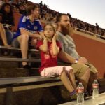 Sucktones Stadium Tour: a little girl plugging her fingers in her ears while Jason's band plays at House Park Stadium