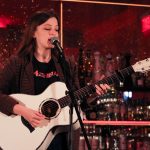 101X-Session Featuring UKTX Artist Jade Bird: Jade Bird strumming guitar and singing