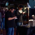 The 101X Day Party during SXSW-Day 1: two men signing up for the 101XCursion