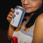 101X Homegrown Live Presents Pennyfest 2019: Woman holding Hi Sign Beer 