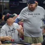 Beat The Dick Poker Tournament : A listener wearing a Beat The Dick t-shirt with Jason who is wearing a shirt that says The Dick