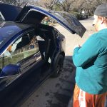 Tesla Wings: Jason in front of his new Tesla. 