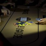 Beat The Dick Poker Tournament : poker chips in the middle of a poker table