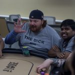 Beat The Dick Poker Tournament : jason dick holding up five fingers at a poker table, 