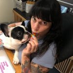 A Bag of D’s: Deb eating a piece of yellow candy. 