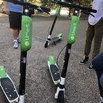 Lime Scooters Close Up : Jason, Deb and Nick try out lime scooters in the Emmis Austin radio from parking lot. 