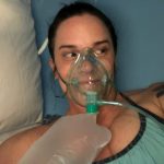 Deb Does Hyperbaric Oxygen Therapy At ATX Hyperbarics: Deb O'Keefe hooked up to an oxygen mask in a hyperbaric chamber