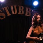 101X Homegrown Live Presents Otis Wilkins' Single Release Party: Jane Ellen Bryant on stage with the Stubbs sign behind her