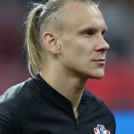 Domagoj Vida: Croatia Defender: Domagoj Vida: Croatia Defender in the field side view with a ponytail 