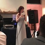 Alex's sister giving her best woman speech.