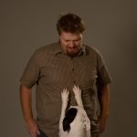 Blue telling Uncle Jason to get out of the way.: Blue photo-bombing Jason during a promotional photo shoot.