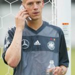 Christian Ziege: Former Germany Midfielder: Christian Ziege: Former Germany Midfielder on the phone with shaved mohawk 