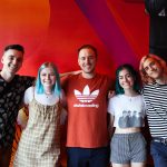 101X-Session with half•alive at Aviator Nation: Half Alive posing with two fans