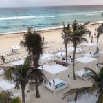 Producer Imari's Trip To Cancun: Beach view in Mexico with cabanas. 
