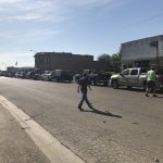 Trash Day In Granger, Texas: A line of vehicles waiting to dump their trash