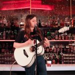 101X-Session Featuring UKTX Artist Jade Bird: Jade Bird strumming guitar and singing