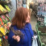 Jason Takes Amsterdam : Jason's mom in a plant shop holding roots in Amsterdam. 