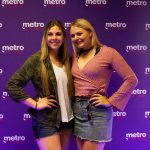 The 101X Day Party During SXSW-Day 3: Women standing in front of the metro by Tmobile step and repeat