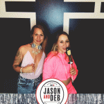 Jason & Deb's Don't Go Downtown NYE Party: two girls posing with props