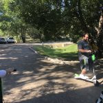Someone Has Been Practicing : Jason, Deb and Nick try out lime scooters in the Emmis Austin radio from parking lot. 