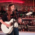101X-Session Featuring UKTX Artist Jade Bird: Jade Bird strumming guitar and singing
