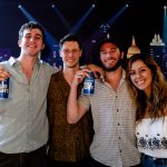 101X Concert Series Ft. RÜFÜS DU SOL: Friends posing in front of the stage