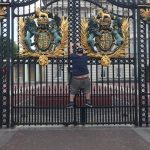 Jason Visits London: Jason trying to climb a fence in London. 