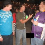 Jason As Brett Favre: Jason posing with listeners while dressed as brett favre with his penis exposed