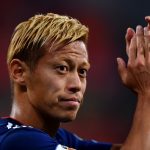Keisuke Honda: Japan Midfielder: Keisuke Honda: Japan Midfielder clapping on the soccer field 
