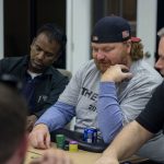 Beat The Dick Poker Tournament : Jason dick sitting a the poker table with chips in front of him