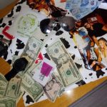 Producer Imari's Trip To Cancun: Money and Mexican Pesos on a desk in Mexico. 
