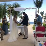 Nick In Mexico: the bride and groom holding hands at the alter
